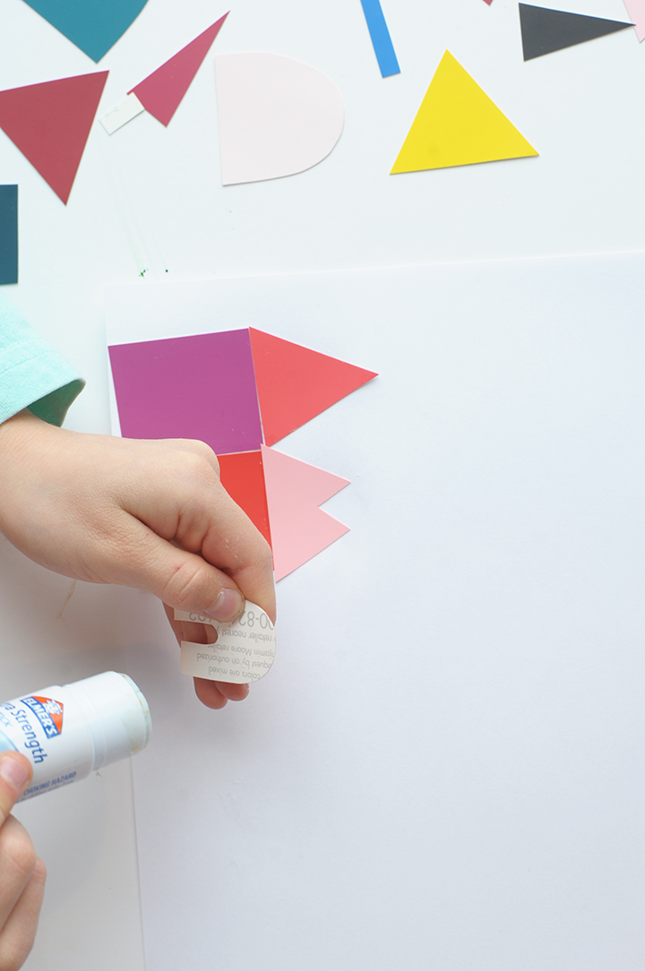 DIY Paint Chip City Kids Craft Here’s a simple way to get the kids creative this summer. Collect some paint chips from your favorite paint store. We gathered up a bunch of them when my friend who owns the paint store was changing out one of her displays.  It’s amazing too see what your little ones will create with these. We cut out simple shapes – squares, triangles, half circles and rectangles and created our very own cities.