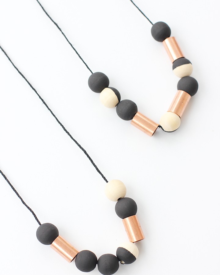 Make this handmade wood bead necklace with copper beads from the hardware store. Perfect for your Fall outfits.