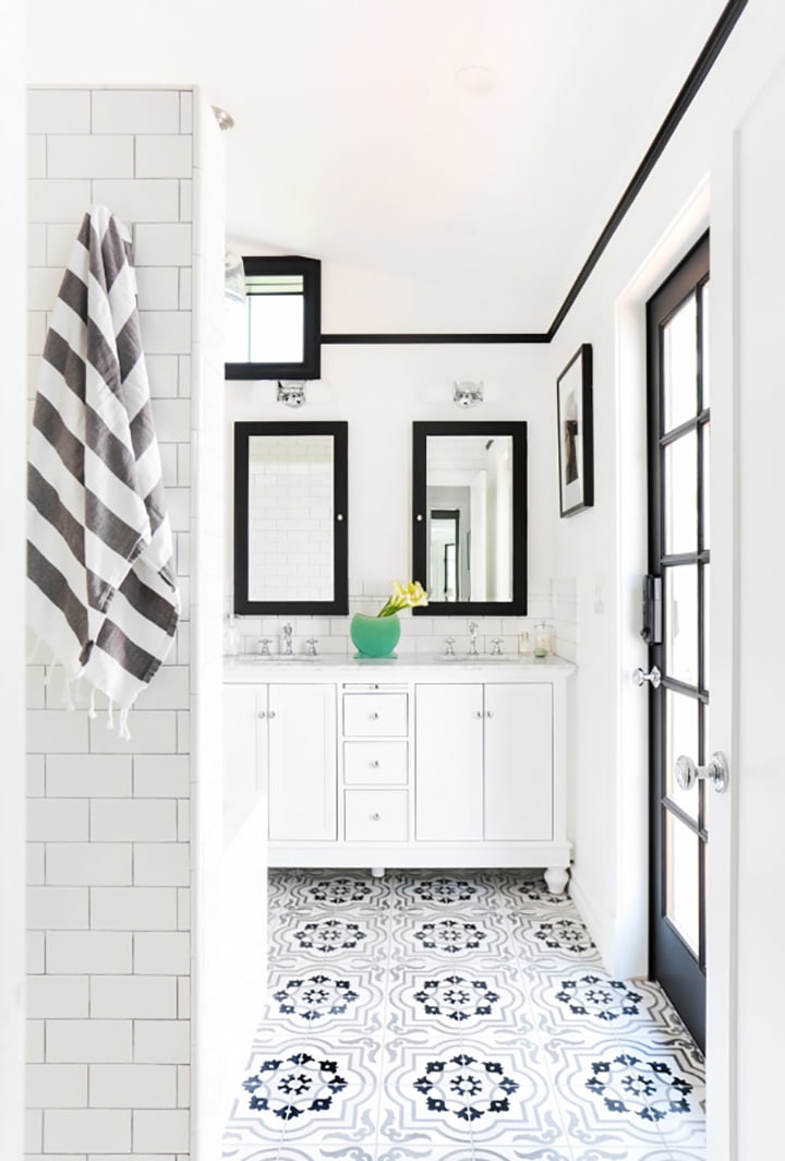 Love this black and white patterned tile floor in this bathroom.