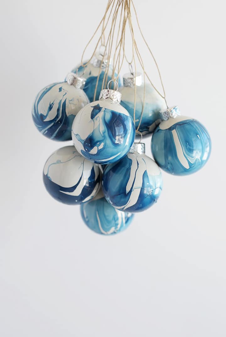 All you need is five minutes and some nail polish to create these DIY Indigo Marbled Ornaments!