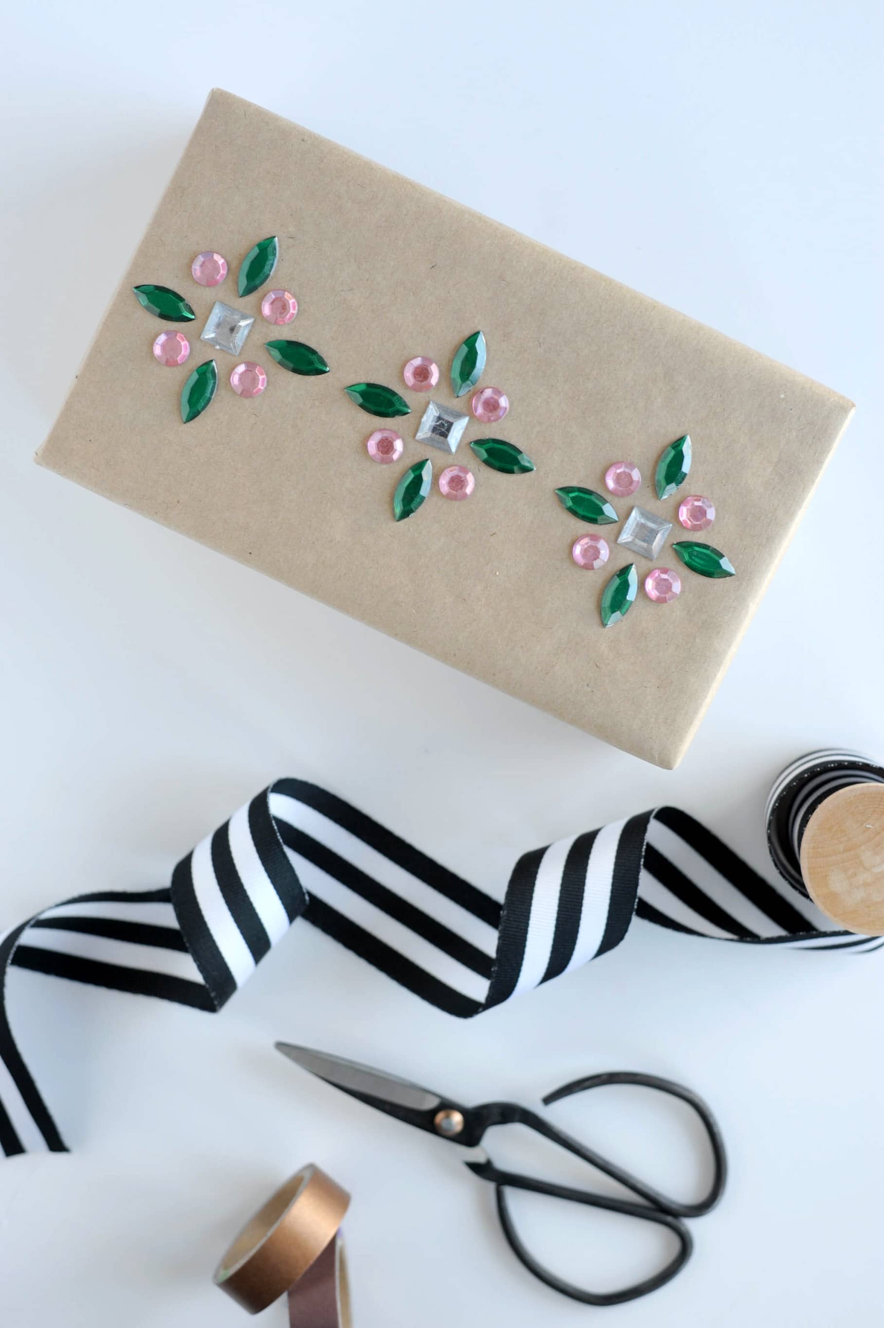 Add some color and pretty patterns to your gift wrap with self adhesive rhinestones!