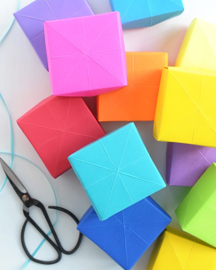 We love DIY projects that are versatile in every sense of the word. Versatile projects that can be as much fun for the kids as it can be for adults, and versatile in how the finished project can be used. These DIY paper boxes can be gift boxes, trinket boxes to hold kid’s treasures, little storage boxes for your office supplies or hold all your precious small craft supplies. We partnered with our friends at AstroBrights® Papers this week to share our tutorial for these colorful DIY paper boxes.