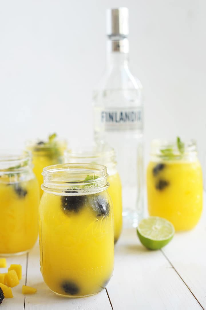 Love making these Mango Blackberry Cocktails in mason jars for summer parties!