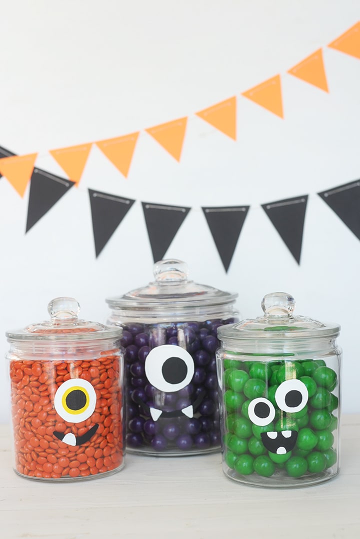Make these hand-painted DIY Halloween Monster Jars for your little goblins!